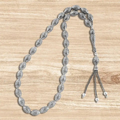 999 silver prayer bead with oval-shaped beads engraved with a precise geometric pattern - Rosary