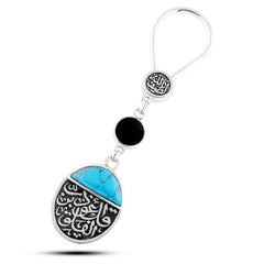 Egyptian sterling silver keychain with **two-sided design**.