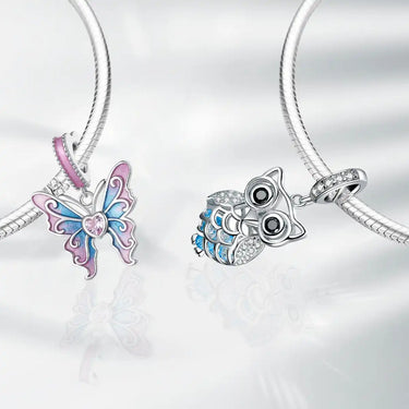 Butterfly and owl charm bracelets.
