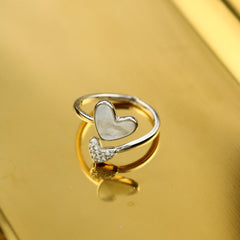 A 925 silver ring featuring a heart-shaped design and pearl, perfect for gifting to someone special.