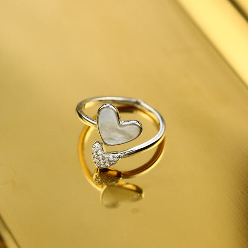 A 925 silver ring featuring a heart-shaped design and pearl, perfect for gifting to someone special.