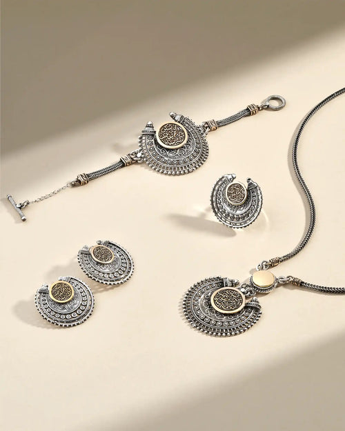 Matching silver and gold jewelry set.