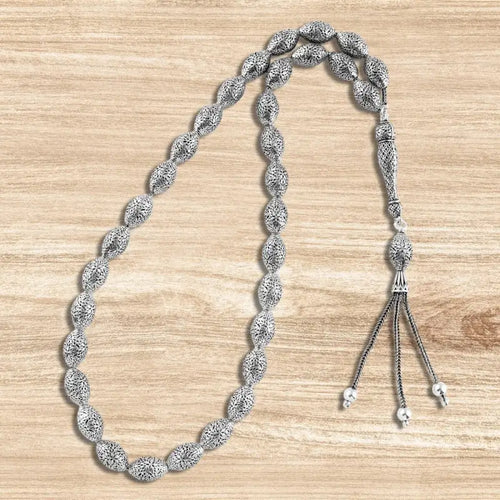 999 silver prayer bead with oval-shaped beads engraved with a precise geometric pattern - Rosary