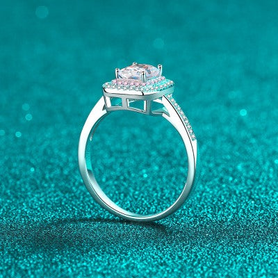 A 925 silver ring featuring an emerald-cut Moissanite stone, known for its stunning brilliance and clarity.