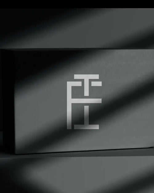 Gray box with a silver monogram.