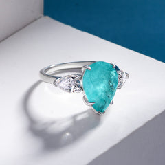 A 925 silver ring with a pear-shaped tourmaline stone, perfect for adding a touch of color and elegance.