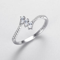 A 925 silver ring featuring triple zircon stones, perfect for a bold and dazzling look.